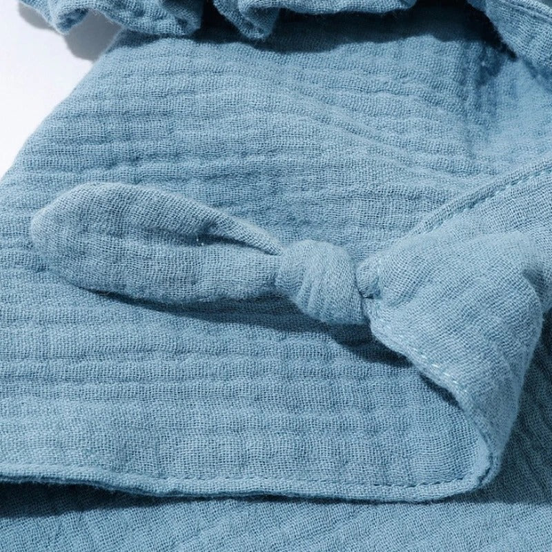 Doudou lapin avec petits nœuds à mordiller
