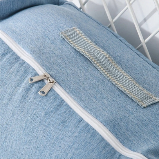 Reducteur de lit bébé transformable en sac de voyage