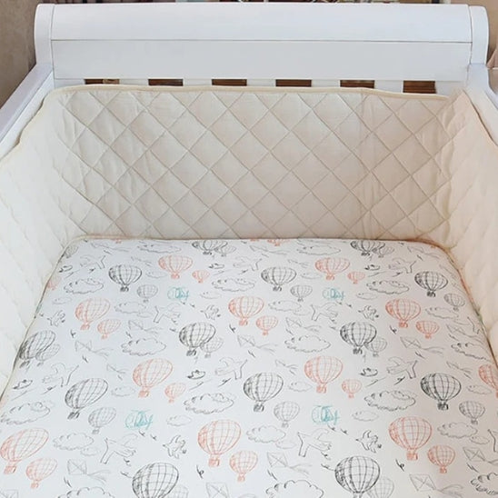 Tour de lit bébé couleur crème douceur chambre bébé