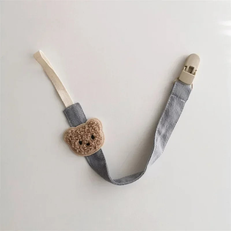 Attache tetine grise avec clip securisé