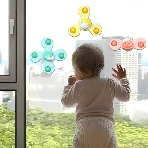 Jouet bebe joue avec 3 toupies ventousées vitre