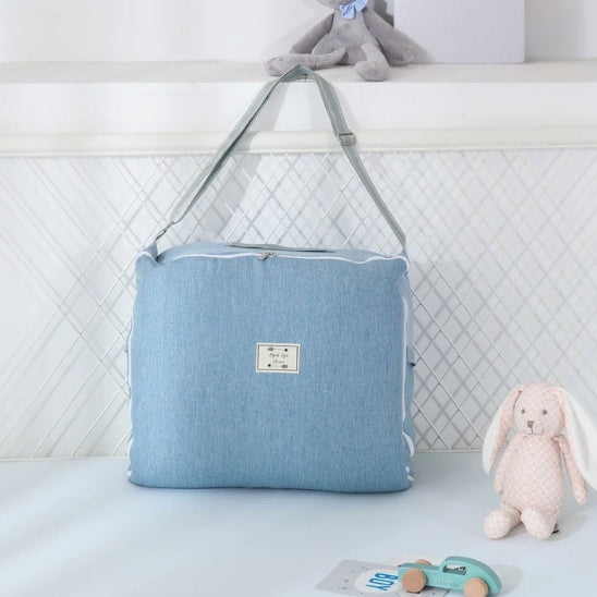 Reducteur de lit bébé pliable et compact idéal pour voyager